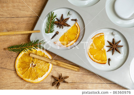 DIY scented soy wax sachet with orange slices, clove spice, spruce and orange essential oils. Winter fresh wax sachet DIY scented soy wax sachet with orange slices, clove spice, spruce and orange essential oils. Winter fresh wax sachet 86360976