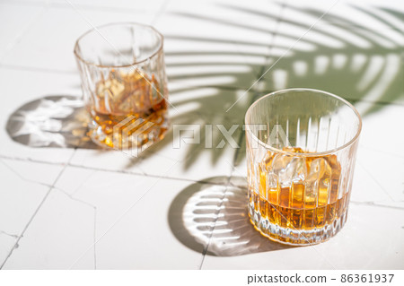Whiskey with ice in glasses Whiskey with ice in glasses 86361937