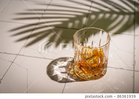 Whiskey with ice in glasses Whiskey with ice in glasses 86361939