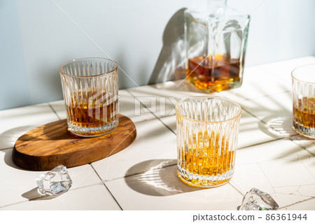 Whiskey with ice in glasses Whiskey with ice in glasses 86361944