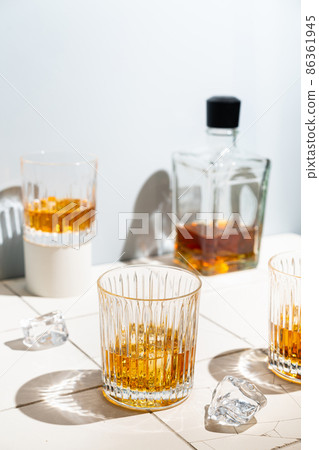 Whiskey with ice in glasses Whiskey with ice in glasses 86361945