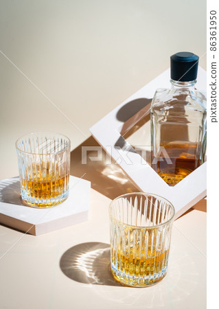 Whiskey with ice in glasses Whiskey with ice in glasses 86361950