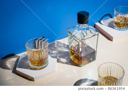 Whiskey with ice in glasses Whiskey with ice in glasses 86361954
