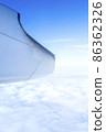 A wonderful view from the window of an airplane: blue sky and sunshine 86362326