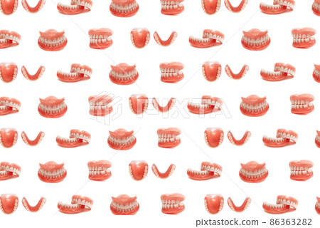 Set of dentures on a white background. Full removable plastic denture of the jaws. Isolate on white background acrylic prosthesis of human jaws. Upper and lower jaws with fake teeth. Jaw in all angles Set of dentures on a white background. Full removable plastic denture of the jaws. Isolate on white background acrylic prosthesis of human jaws. Upper and lower jaws with fake teeth. Jaw in all angles 86363282