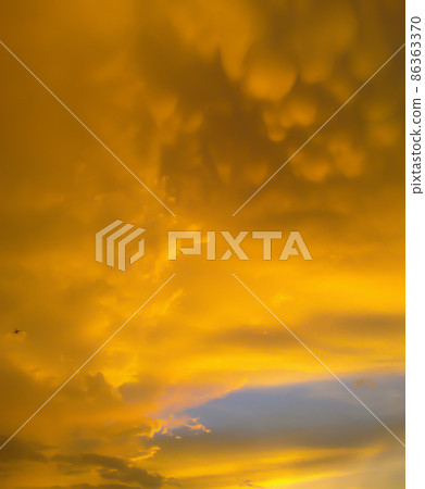 Magical yellow Sunset, cloudy sky and light reflections Magical yellow Sunset, cloudy sky and light reflections 86363370