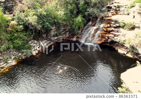 Wonderful dark waterfall pool in Chapada Diamantina, Brazil Wonderful dark waterfall pool in Chapada Diamantina, Brazil 86363371