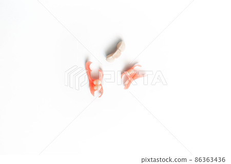 Dental prosthetics on a white background. Dentures. Dentistry. Prosthetic teeth. Dental plates. Artificial teeth. Prosthetic dentistry. Set of dentures on a white background. Copy space Dental prosthetics on a white background. Dentures. Dentistry. Prosthetic teeth. Dental plates. Artificial teeth. Prosthetic dentistry. Set of dentures on a white background. Copy space 86363436