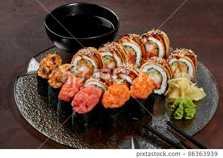 Sushi set of gunkan maki and rolls with eel on platter Sushi set of gunkan maki and rolls with eel on platter 86363939