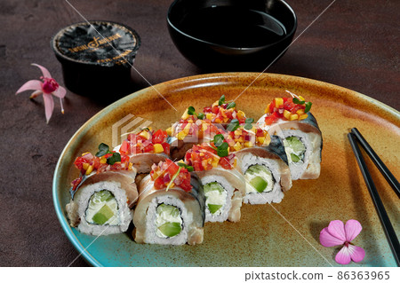 Rolls with mackerel fillet and vegetables on plate with soy sauce Rolls with mackerel fillet and vegetables on plate with soy sauce 86363965