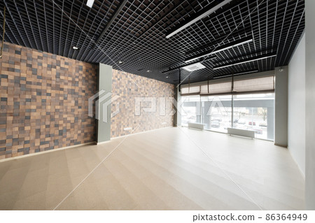 Large gym for fitness classes with large windows 86364949