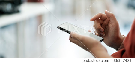 Close up woman using smart phone with hand finger touch screen, texting, chatting or social media 86367421