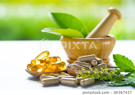 Alternative medicine herbal organic capsule with vitamin E omega 3 fish oil, mineral, drug with herbs leaf natural supplements for healthy good life. 86367437