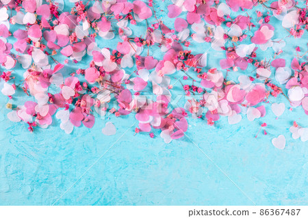 Valentine day or wedding background with hearts confetti on blue Valentine day or wedding background with hearts confetti on blue 86367487