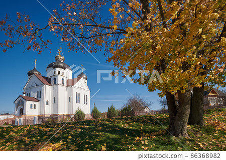 Old ancient orthodox church of the Transfiguration of Jesus Christ church in an autumn landscape. Smorgon, Grodno region, Belarus. Old ancient orthodox church of the Transfiguration of Jesus Christ church in an autumn landscape. Smorgon, Grodno region, Belarus. 86368982