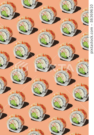 Pattern of rolls with prawn fillet on pinkish orange background 86369610