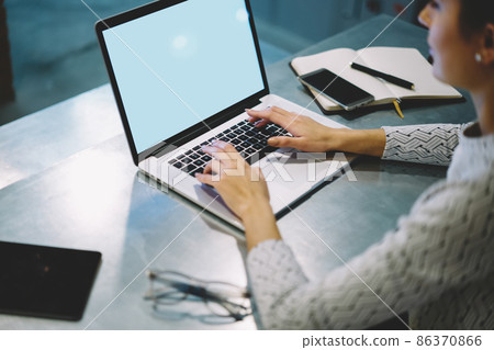 Crop female using laptop for work Crop female using laptop for work 86370866