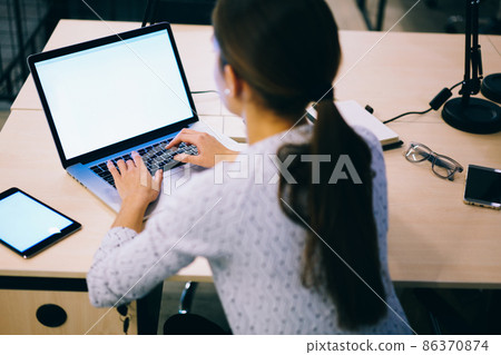 Faceless woman using computer and tablet Faceless woman using computer and tablet 86370874