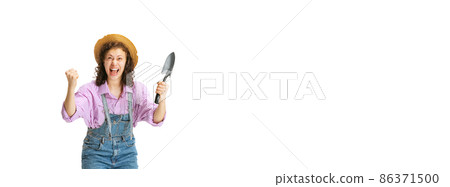 Excited young girl, gardener in work uniform and hat posing isolated on white background. Concept of job, emotions, agronomy, eco Excited young girl, gardener in work uniform and hat posing isolated on white background. Concept of job, emotions, agronomy, eco 86371500