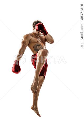 Full size of professional kickboxer in red sportswear on white background. muscular athlete fighting Full size of professional kickboxer in red sportswear on white background. muscular athlete fighting 86371816