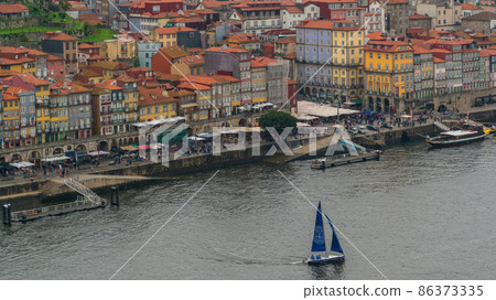Porto, Portugal - April 2018: Panoramic view of Old Porto Oporto city and Ribeira over Douro river from Vila Nova de Gaia, Portugal 86373335