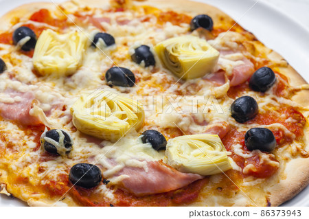 pizza with ham, black olives and artichokes pizza with ham, black olives and artichokes 86373943