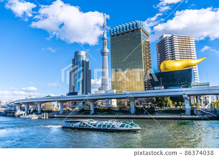 View of Tokyo cityscape of Japan, Sumida River and water bus "Emeraldas" 86374038