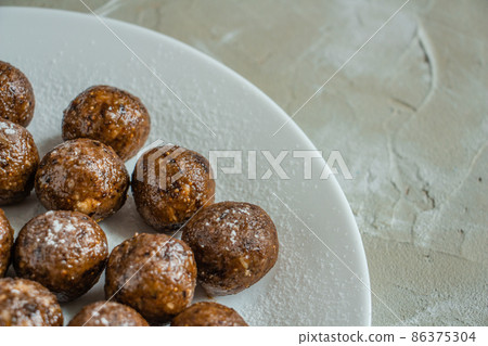 truffles with cocoa, coconut, sesame, delicious dessert on a concrete background 86375304