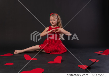 The girl lies happy with a big heart valentine kid black my paper, for pastel repeat from shape for trendy graphic, heart endless. Abstract happy decoration, white shows the heart with his hands 86375550