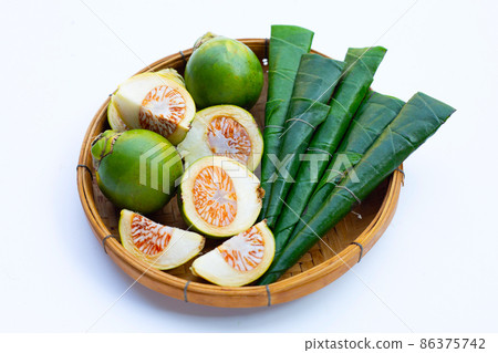 Chewing betel nut with betel leaves in bamboo basket 86375742