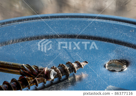 Screw with sheared threading after stress failure next to an intact example Screw with sheared threading after stress failure next to an intact example 86377116