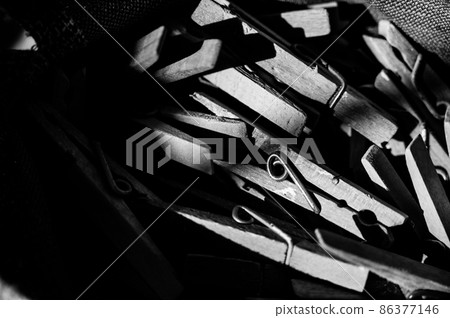 assorted pile of old cloths pins in a bag used for hanging wet laundry 86377146