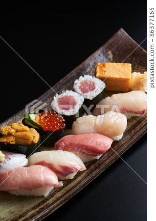 Nigiri sushi served on a plate 86377165