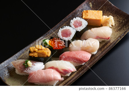 Nigiri sushi served on a plate 86377166