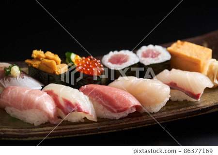 Nigiri sushi served on a plate 86377169