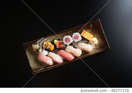 Nigiri sushi served on a plate 86377178