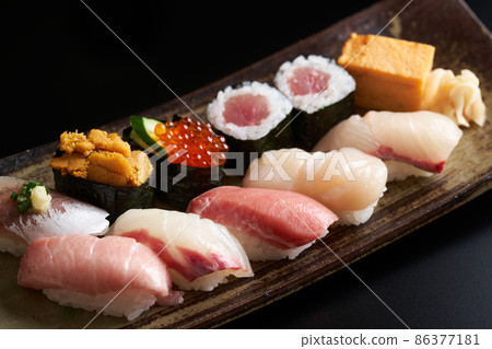 Nigiri sushi served on a plate 86377181