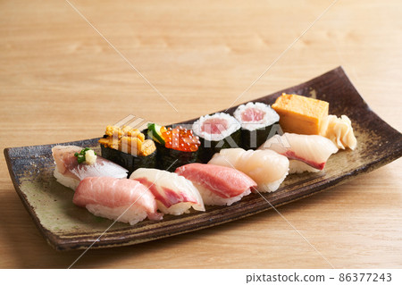 Nigiri sushi served on a plate 86377243