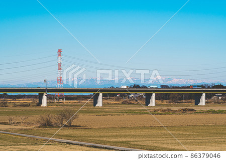 Arakawabashi Expressway, winter riverbed and mountains such as Mt. Nikko-Shirane 2022.01 b-3 film style Arakawabashi Expressway, winter riverbed and mountains such as Mt. Nikko-Shirane 2022.01 b-3 film style 86379046