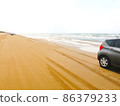 A view of a car driving along the coast 86379233