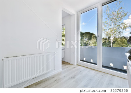 Stylish light corridor with a glass door with a white frame 86379266