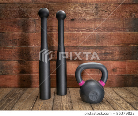 pair of heavy steel Indian clubs and kettlebell 86379822