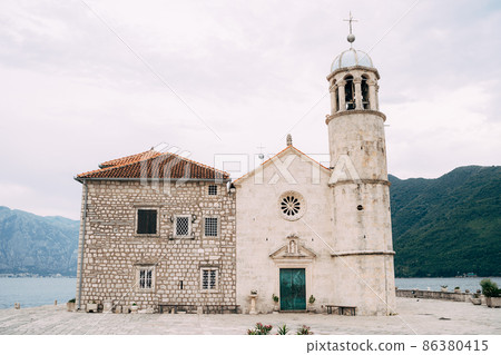 Church of Our Lady on the rocks on the artificial island of Gospa od Skrpjela 86380415