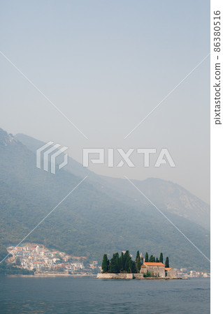 Saint George island on the background of green mountains Saint George island on the background of green mountains 86380516