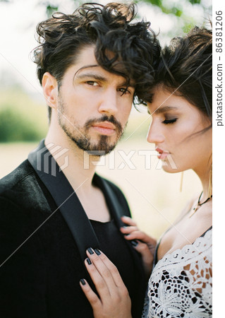 Bride put her hands on the groom chest. Portrait Bride put her hands on the groom chest. Portrait 86381206