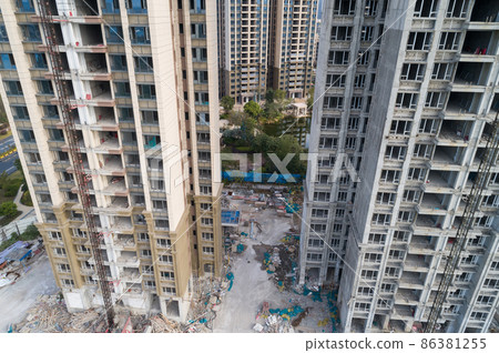 Aerial view of multistory apartment construction site in China Aerial view of multistory apartment construction site in China 86381255