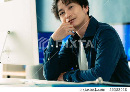 A man heading to a computer A man heading to a computer 86382938