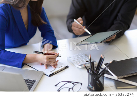 Businesswoman and businessman planning their project strategy 86383274