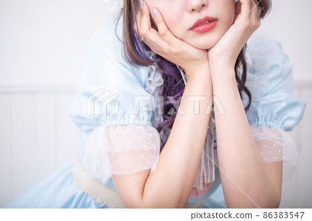 Lolita staring at her with a cheek stick 86383547