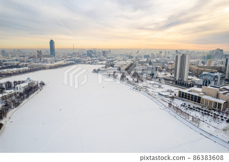 Yekaterinburg aerial panoramic view in Winter at sunset. Ekaterinburg is the fourth largest city in Russia located in the Eurasian continent on the border of Europe and Asia. 86383608